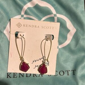 Three pairs of Kendra Scott earrings with gold hardware